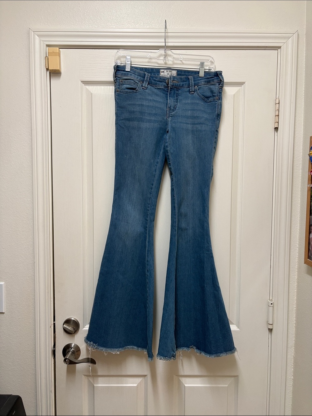 Free People Medium Blue Flare Jeans with Frayed Hem